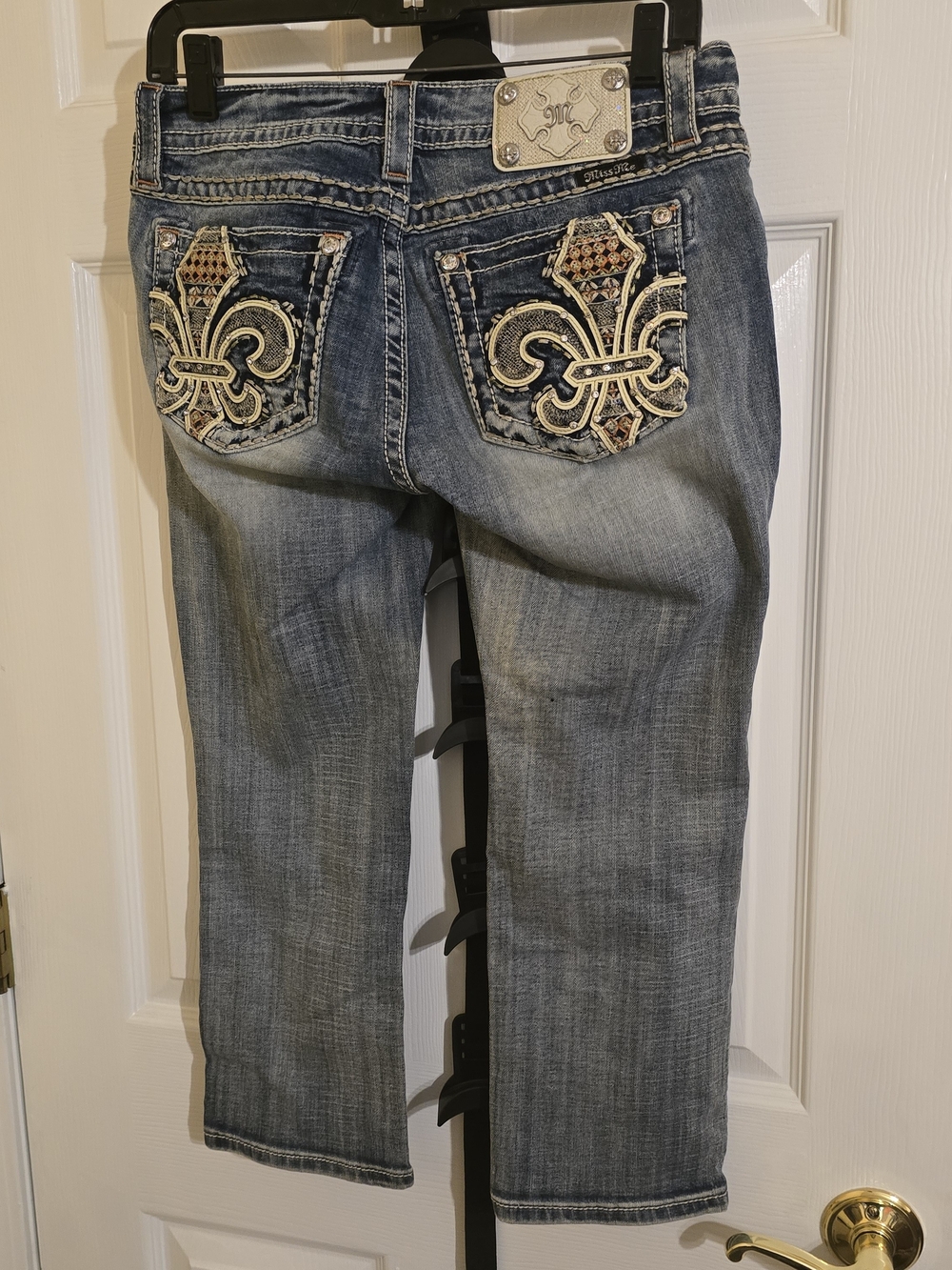 Miss Me Blue Distressed Cropped Jeans with Embroidered Fleur-de-Lis